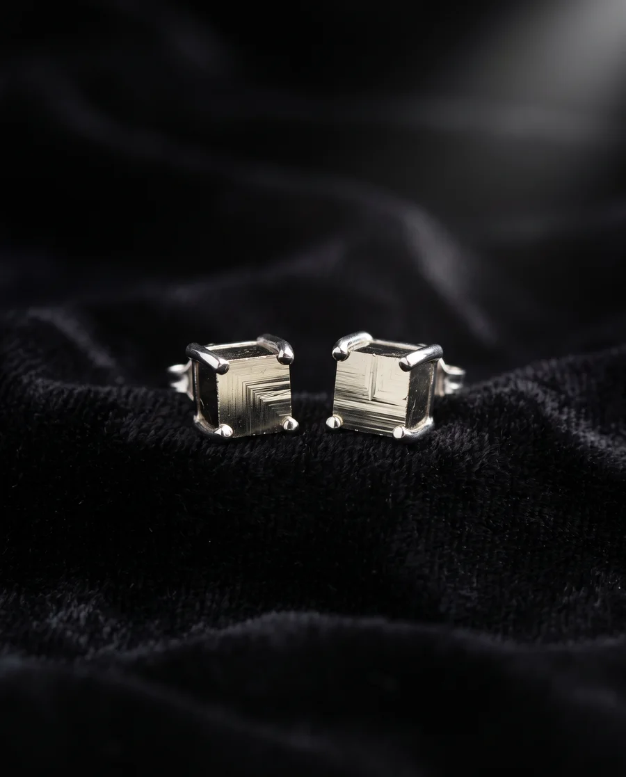 Pair of tiny pyrite cube stud earrings in platinum settings